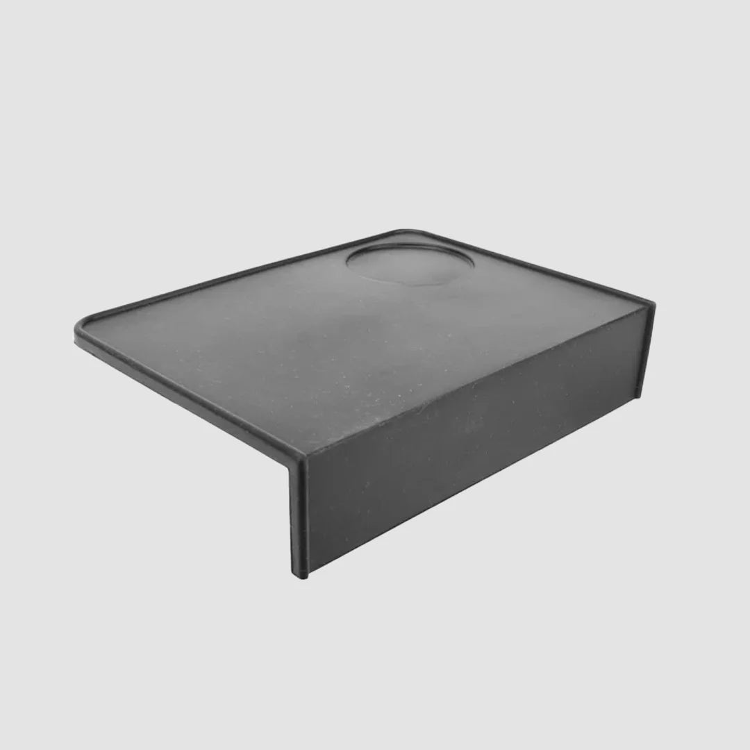 Tamping mat with corner